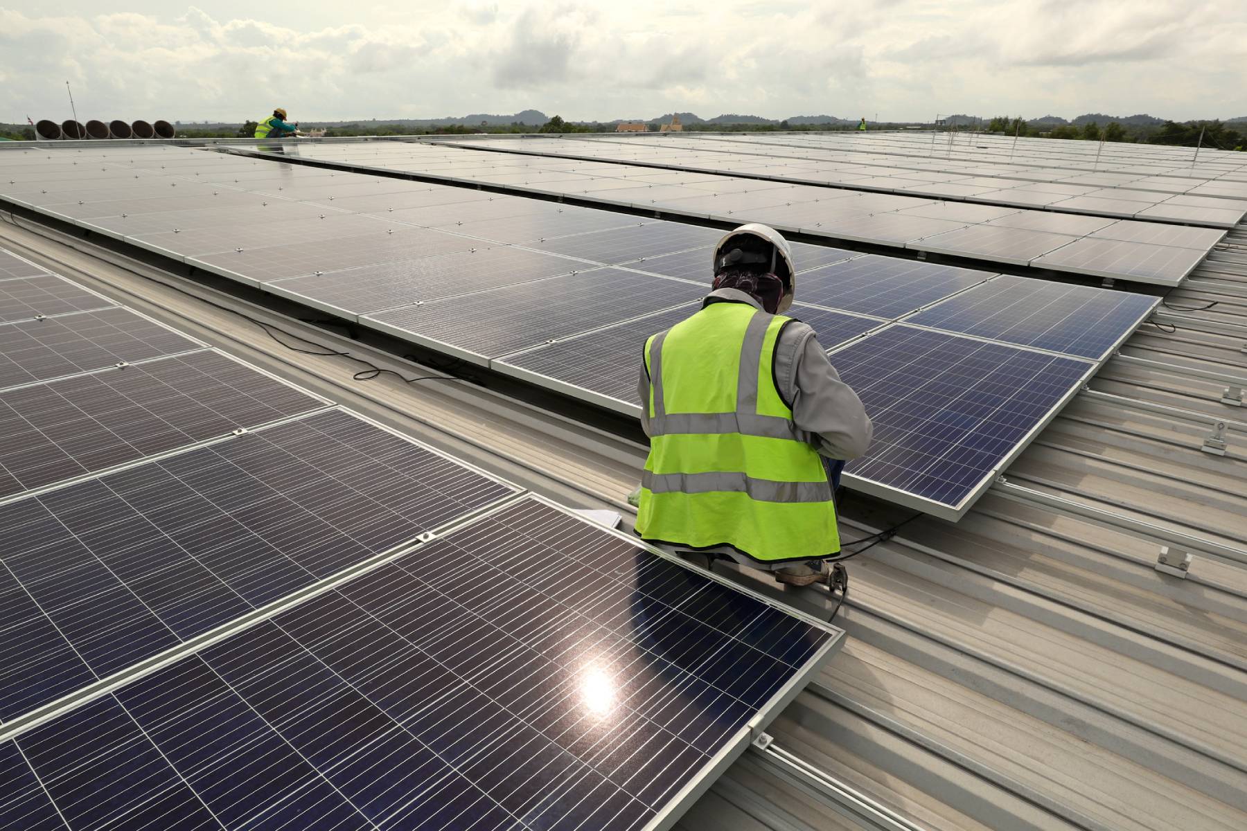 technician working on solar panel
