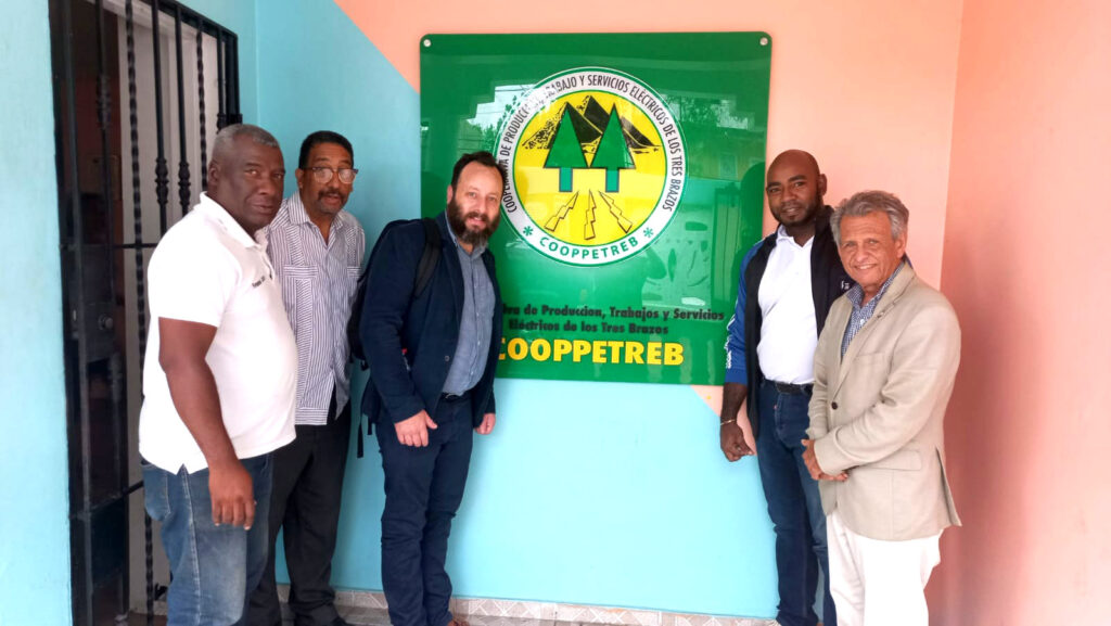 Max Lainfiesta, third from the left, alongside local partners in the Dominican Republic, advocating for clean energy access through the blended finance model, 2022.