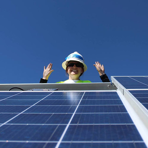 Kaitlyn Bunker with solar panels