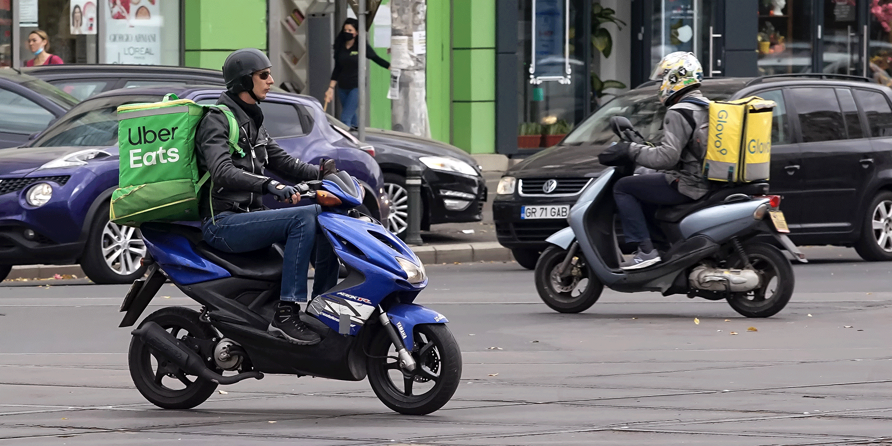 Uber Eats delivery person riding a scooter