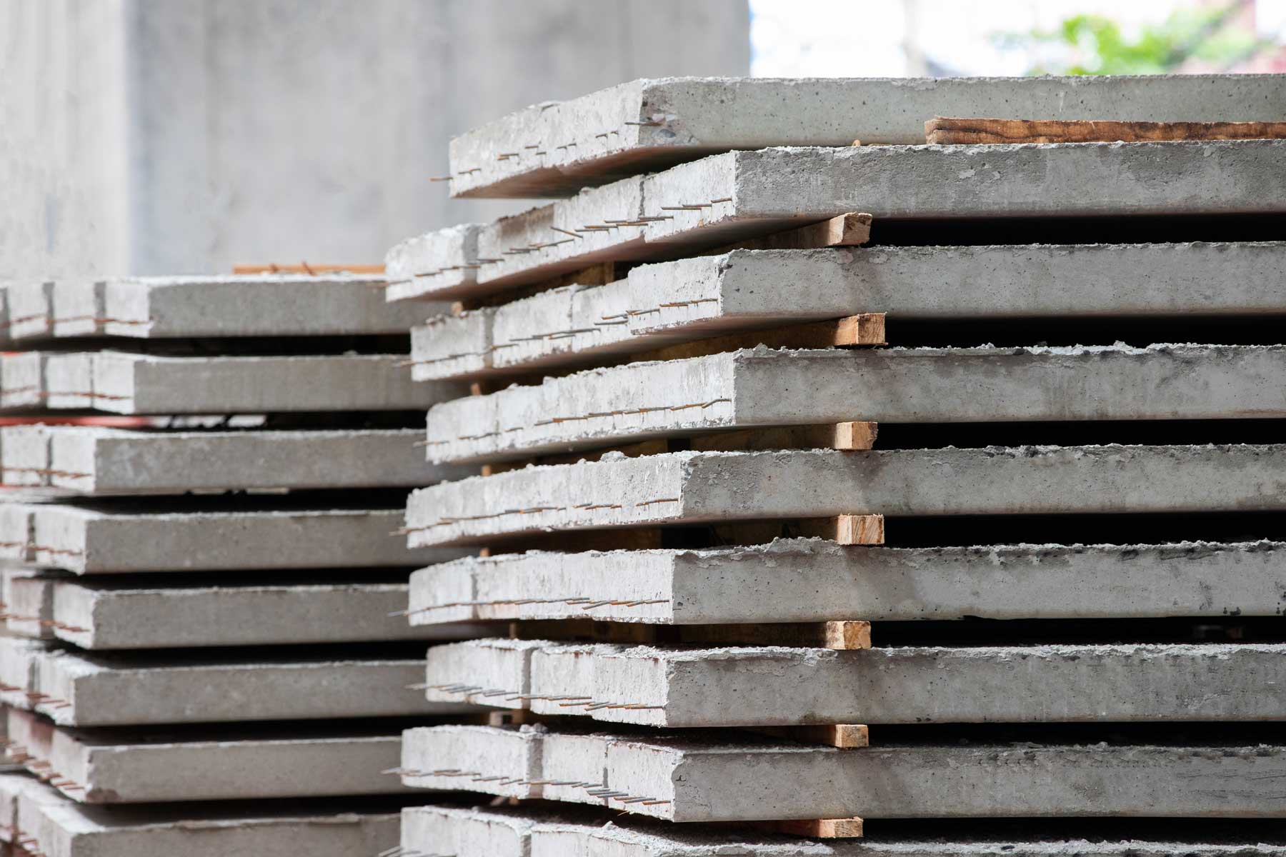 Stacks of precast concrete blocks in a construction supply yard