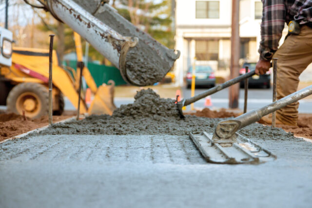 Unlocking Low-Carbon Cement and Concrete Through Book and Claim