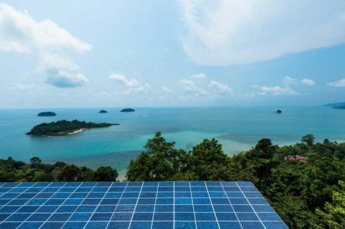 ocean islands with solar panels in foreground