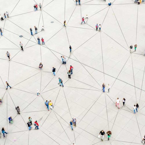 aerial of people on a platform forming a connected network