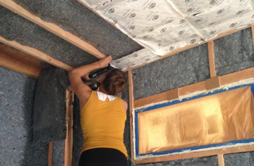 putting insulation into walls