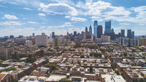 The remote aerial view on Philadelphia Downtown over the residential district of the city. Pennsylvania, USA.The remote aerial view on Philadelphia Downtown over the residential district of the city. Pennsylvania, USA.