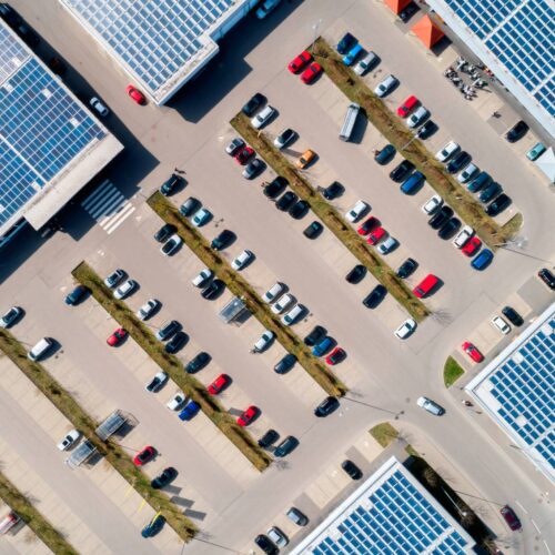 aerial view of parking lot with solar roofs