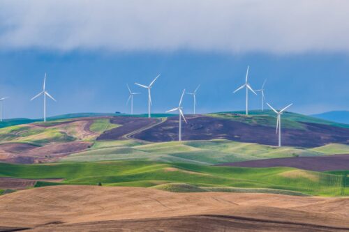 Wind turbines on green hills
