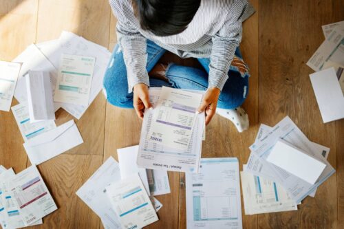 woman with piles of paper