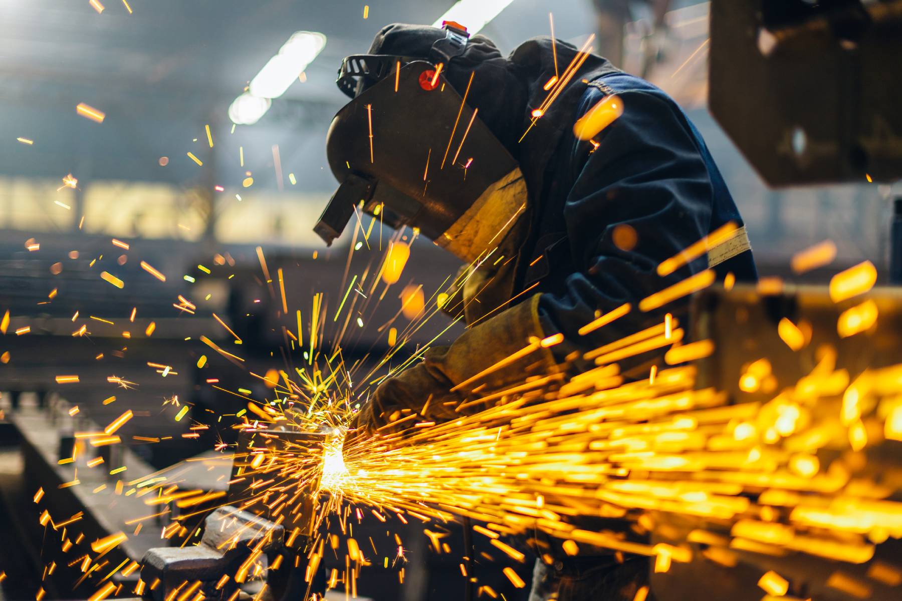 https://rmi.org/wp-content/uploads/2022/07/metal-worker-iStock-1172812354.jpg