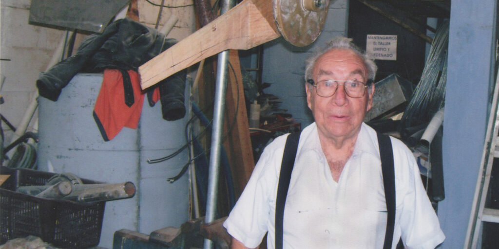 Max Lainfiesta’s father, Maximilian, building a prototype of a neodymium permanent magnet wind generator, 2000