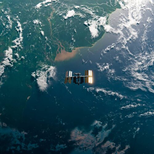 ISS orbiting over forested continent