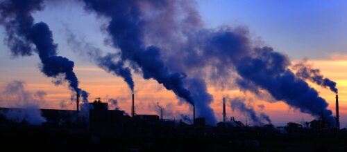 factory pollution smoke billowing out