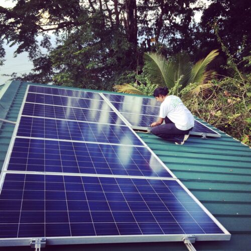 Siana working on a solar panel