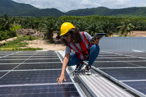 female engineer working on solar panels