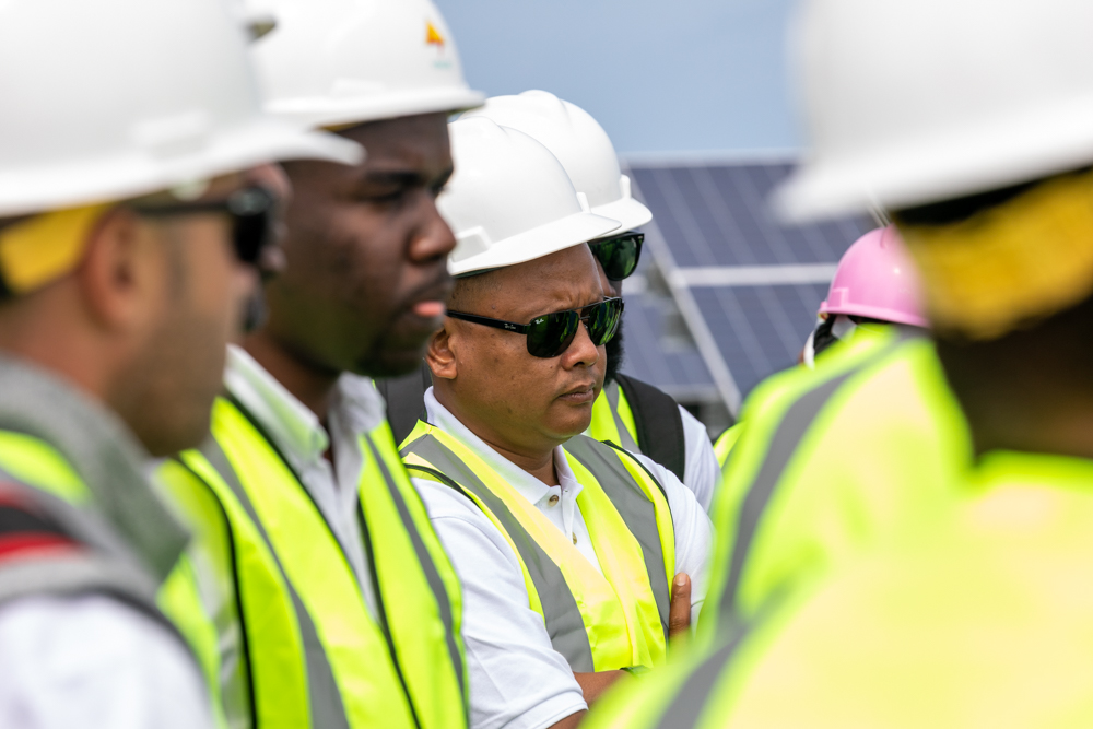 Fellows listen to the introduction at the 6 MW airport solar site.