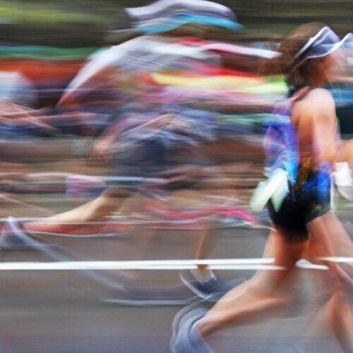 blurred runners in a race