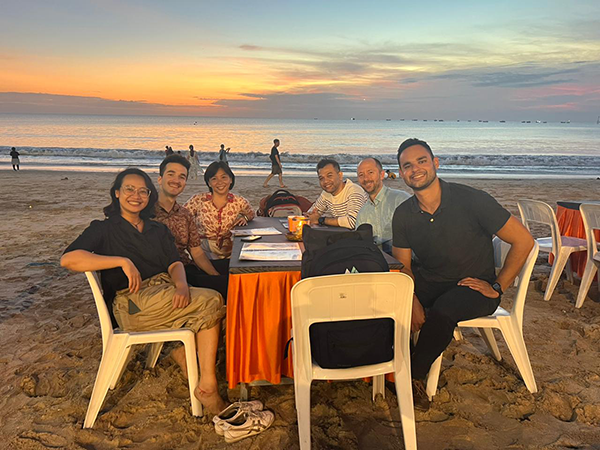 RMI’s Southeast Asia–based team meet for dinner on the beach in Bali, Indonesia, in July 2023.