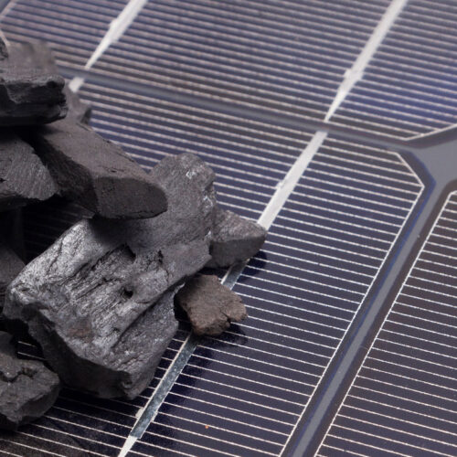 raw coal on solar panel