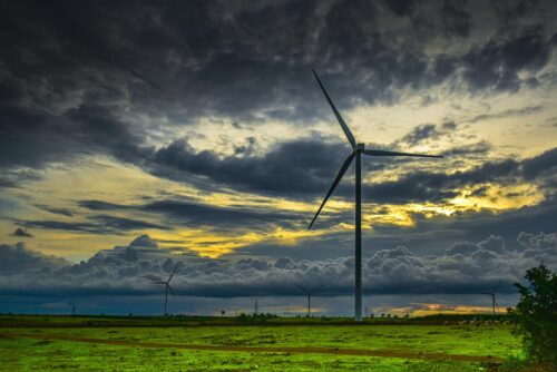 windmill at sunset with heavy clouds