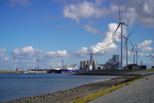 wind turbines with power plant on river