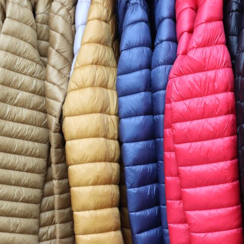 multicolor puffy winter jackets hanging