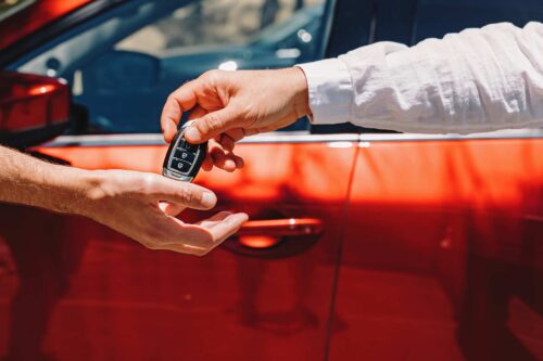 dealer giving car keys