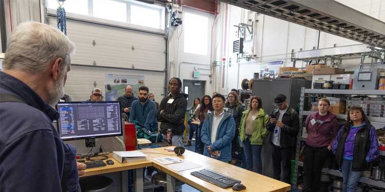 participants in the Energy Leadership Accelerator in Alaska listen to a presentation